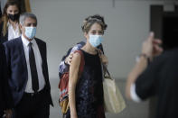 Aya Biran, a paternal aunt of Eitan Biran, who survived a cable car crash in Italy that killed his immediate family, arrives to court in Tel Aviv on Thursday, Sept. 23, 2021 for a hearing in the alleged kidnapping of her nephew. The boy's parents and younger sibling were among 14 killed in May when a cable car slammed into a mountainside in northern Italy. He is now the focus of a custody battle between his maternal grandparents in Israel and his paternal relatives in Italy. (AP Photo/Sebastian Scheiner)