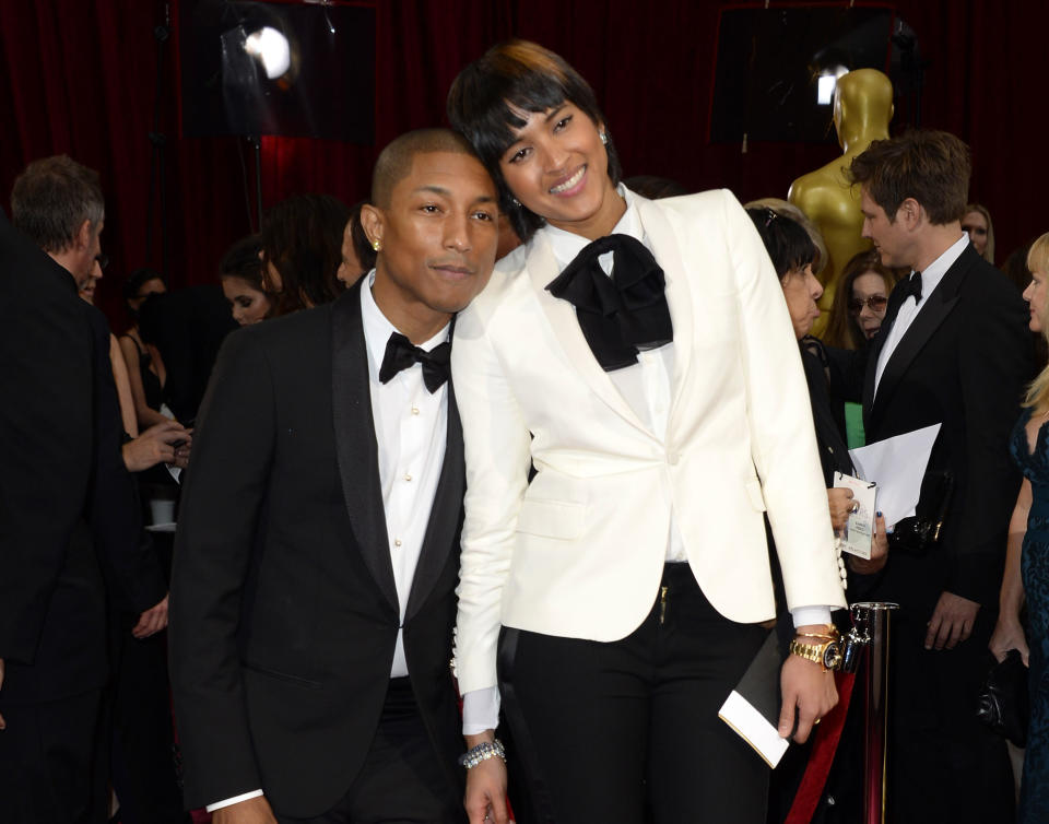 Pharrell Williams, left, and Helen Lasichanh arrive at the Oscars on Sunday, March 2, 2014, at the Dolby Theatre in Los Angeles. (Photo by Dan Steinberg/Invision/AP)