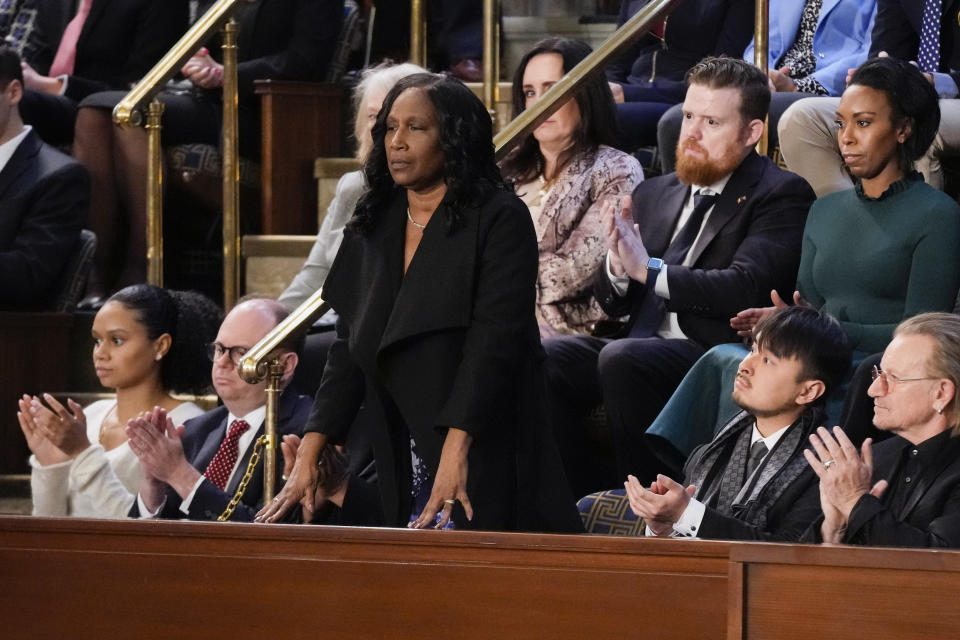 RowVaughn Wells, mother of Tyre Nichols, who died after being beaten by Memphis police officers, stands as she is recognized by President Joe Biden as he delivers the State of the Union address to a joint session of Congress, at the Capitol in Washington, Tuesday, Feb. 7, 2023. (AP Photo/Patrick Semansky)