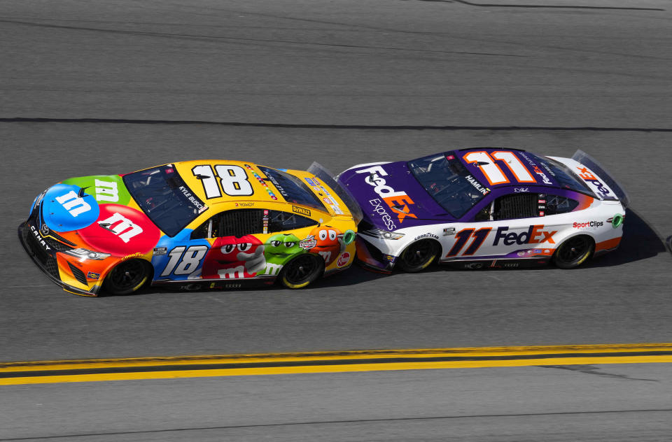 Feb 20, 2022; Daytona Beach, Florida, USA; NASCAR Cup Series driver Denny Hamlin (11) drafts with driver Kyle Busch (18) during the Daytona 500 at Daytona International Speedway. Mandatory Credit: Mike Dinovo-USA TODAY Sports