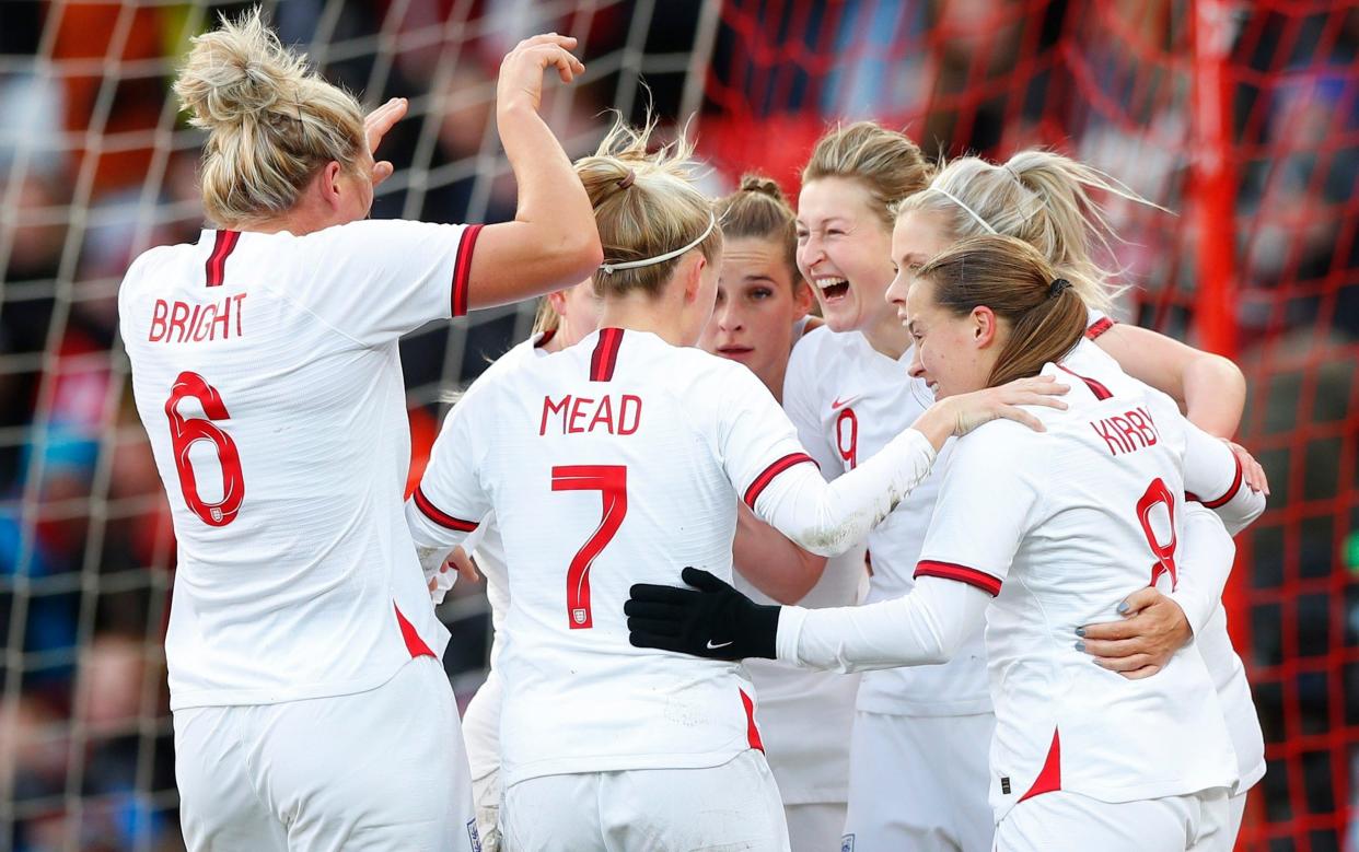 White is congratulated by her team-mates after edging closer to the goal-scoring record - GETTY IMAGES