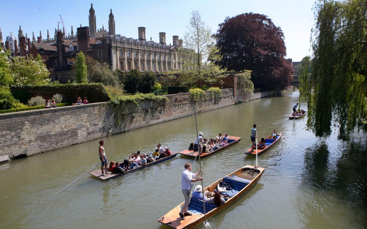 Tourists enjoy punting on the River Cam in Cambridge - Splash News