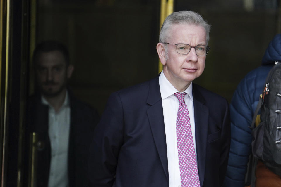 Britain's Minister for Levelling Up, Housing and Communities, Michael Gove, leaves the Millbank Studios in central London after taking part in the morning interview rounds, Thursday March 14, 2024. The British government published an official definition of “extremism” on Thursday, and said groups that get the label will be barred from receiving government funding. The government did not provide examples of extremist groups, and is not expected to publish a list of such organizations for some weeks. But Gove pointed to the threat from the extreme right and Islamic "extremists who are seeking to separate Muslims from the rest of society and create division within Muslim communities.” (Jordan Pettitt/PA via AP)