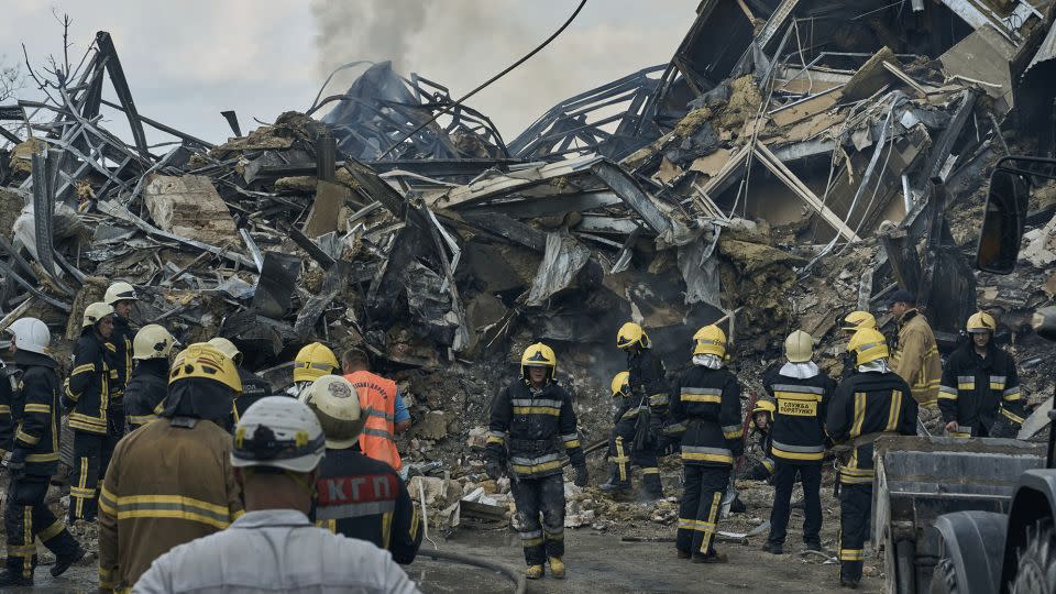 Emergency service personnel work at the site of a destroyed building after a Russian attack in Odesa, Ukraine, July 20, 2023.  - Libkos/AP