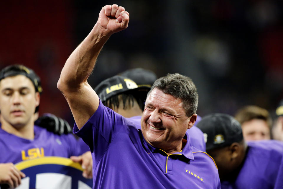 FILE - In this Dec. 7, 2019, file photo, LSU head coach Ed Orgeron celebrates after the team's win over Georgia in an NCAA college football game for the Southeastern Conference championship, in Atlanta. Orgeron is The Associated Press Coach of the Year after leading the top-ranked Tigers to a Southeastern Conference championship and their first College Football Playoff appearance. (C.B. Schmelter/Chattanooga Times Free Press via AP, File)