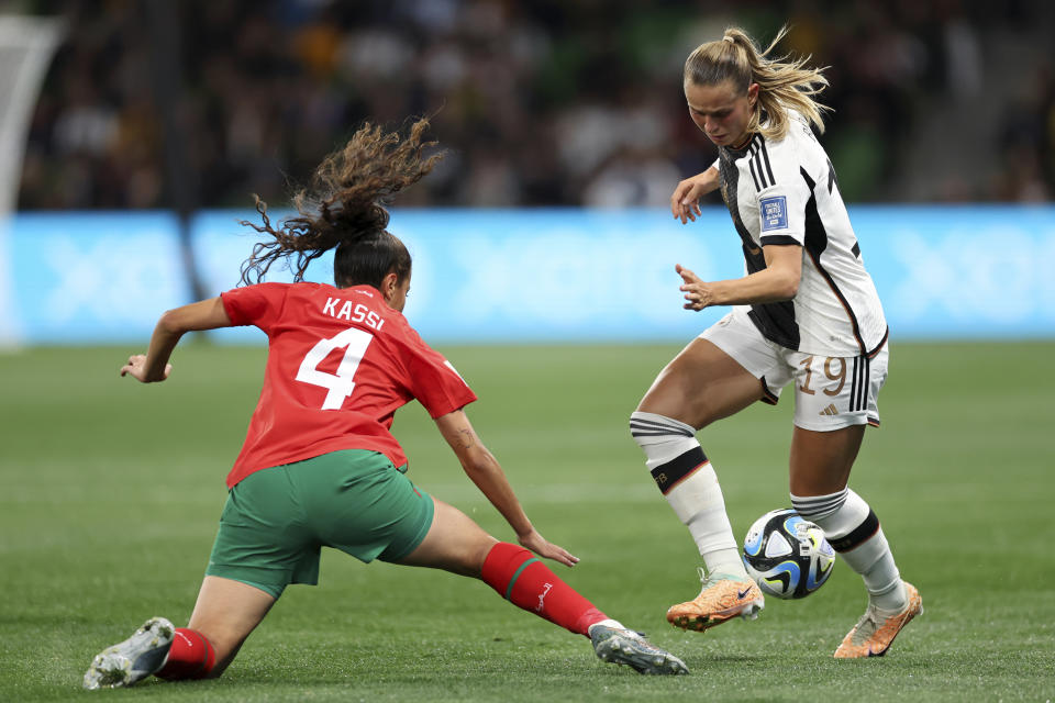 Morocco's Sarah Kassi, left, vies for the ball with Germany's Klara Buehl during the Women's World Cup Group H soccer match between Germany and Morocco in Melbourne, Australia, Monday, July 24, 2023. (AP Photo/Victoria Adkins)