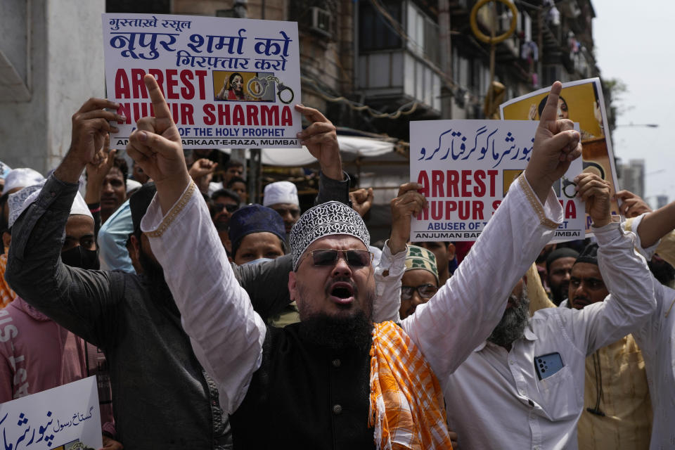 Indian Muslims shout slogans as they react to the derogatory references to Islam and the Prophet Muhammad made by top officials in the governing Hindu nationalist party during a protest in Mumbai, India, Monday, June 6, 2022. At least five Arab nations have lodged official protests against India, and Pakistan and Afghanistan also reacted strongly Monday to the comments made by two prominent spokespeople from Prime Minister Narendra Modi's Bharatiya Janata Party. (AP Photo/Rafiq Maqbool)