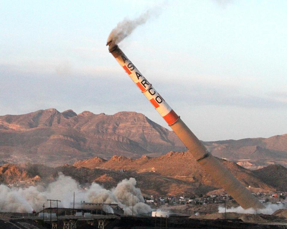 The 828-foot former ASARCO stack hits the ground on April 13, 2013.