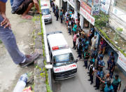 Ambulances leave after a police operation on militants on the outskirts of Dhaka, Bangladesh, July 26, 2016. REUTERS/Mohammad Ponir Hossain