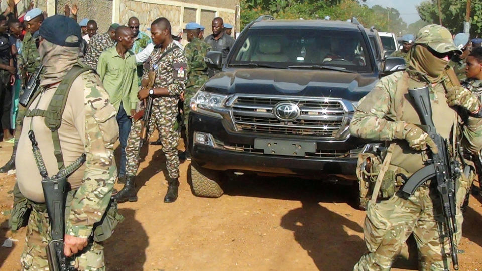 Wagner fighters on foot with a presidential convoy in CAR