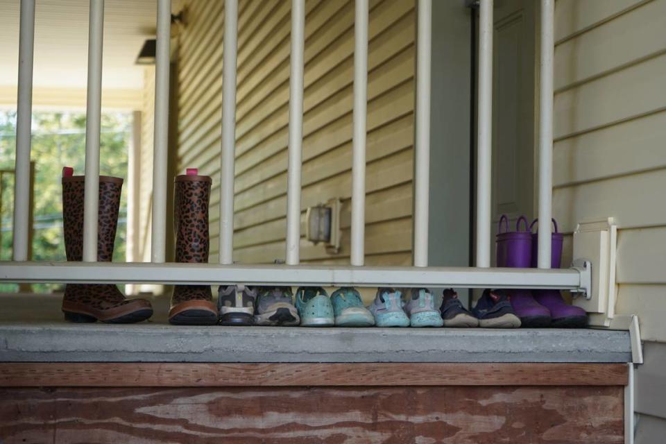 Shoes are lined up outside a residence at the Meadow Wood Townhomes on Sept. 22, in Bellingham, Washington. Residents say there is a strong community at the housing complex. Rachel Showalter/The Bellingham Herald