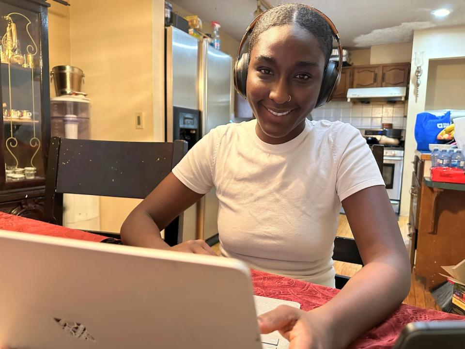 Sara Sail studies for an exam at her sister's kitchen table. She's a third-year marketing student minoring in entrepreneurship and social innovation.