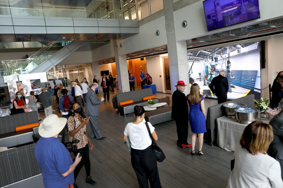 People walk around the atrium of the University of Florida's Herbert Wertheim Laboratory for Engineering Excellence building and labs during the dedication ceremony in Gainesville on Oct. 7.