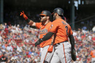 Baltimore Orioles' DJ Stewart (24) celebrates with teammate Jonathan Villar after hitting a two-run home run scoring Villar during the first inning of a baseball game against the Boston Red Sox, Saturday, Sept. 28, 2019, in Boston. (AP Photo/Mary Schwalm)