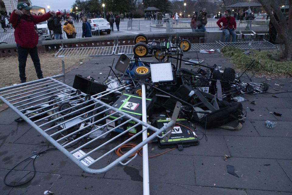 Demonstrators left a pile of broken TV equipment outside the the U.S. Capitol on Wednesday, Jan. 6, 2021, in Washington. (AP Photo/Jose Luis Magana)