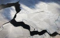 <p>Ice floats near the coast of West Antarctica viewed from a window of a NASA Operation IceBridge airplane on Oct. 27, 2016 in-flight over Antarctica. (Photo: Mario Tama/Getty Images) </p>