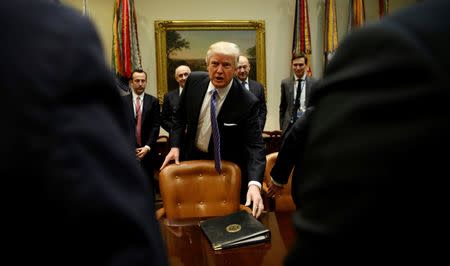 U.S. President Donald Trump arrives for a meeting with business leaders in the Roosevelt Room of the White House in Washington January 23, 2017. REUTERS/Kevin Lamarque