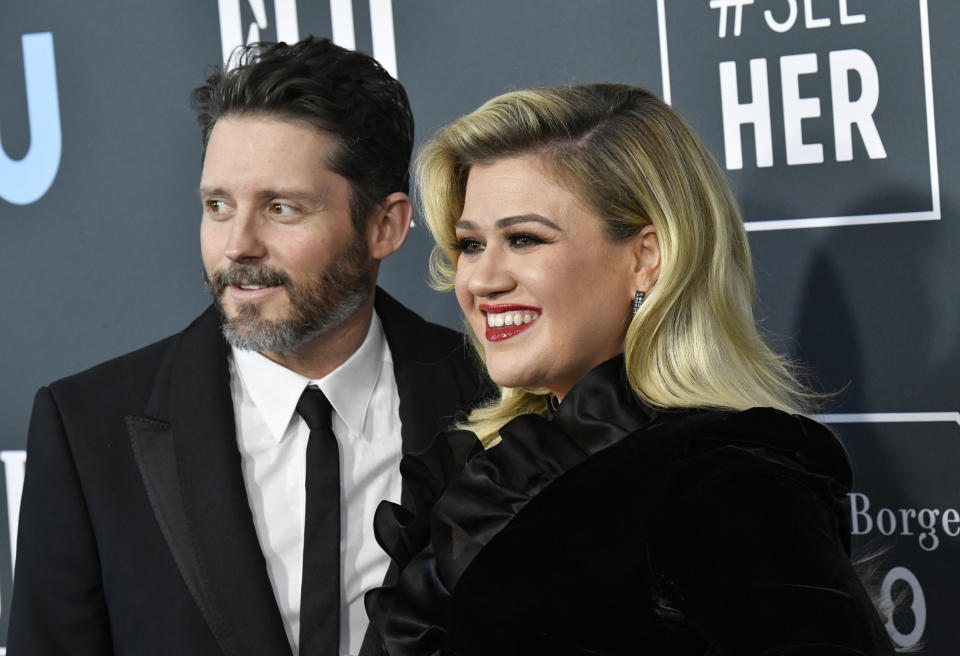 Singer Kelly Clarkson (right) filed for divorce from Brandon Blackstock in June. (Photo: Frazer Harrison via Getty Images)