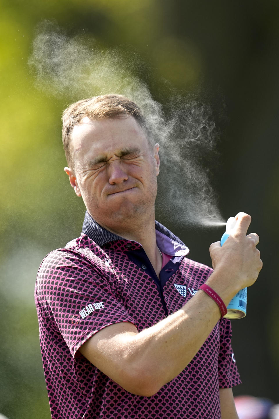 FILE - Justin Thomas applies sunscreen on the 11th hole during the first round of the PGA Championship golf tournament at Oak Hill Country Club on Thursday, May 18, 2023, in Pittsford, N.Y. Thomas, a two-time PGA champion whose father and grandfather were club professionals, said he has always used sunscreen, usually whatever is handy. Now he pays closer attention, and for good reason.(AP Photo/Eric Gay, File)