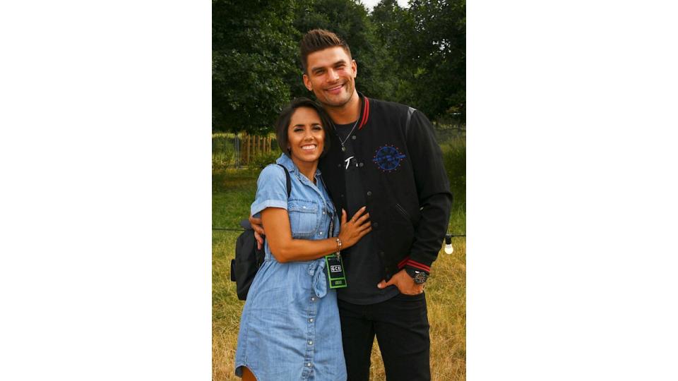 Janette Manrara in a denim dress and Aljaz Skorjanec in a bomber jacket