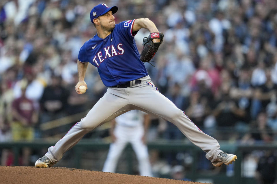 Texas Rangers starting pitcher Max Scherzer throws against the Arizona Diamondbacks during the first inning in Game 3 of the baseball World Series Monday, Oct. 30, 2023, in Phoenix. (AP Photo/Godofredo A. Vásquez)