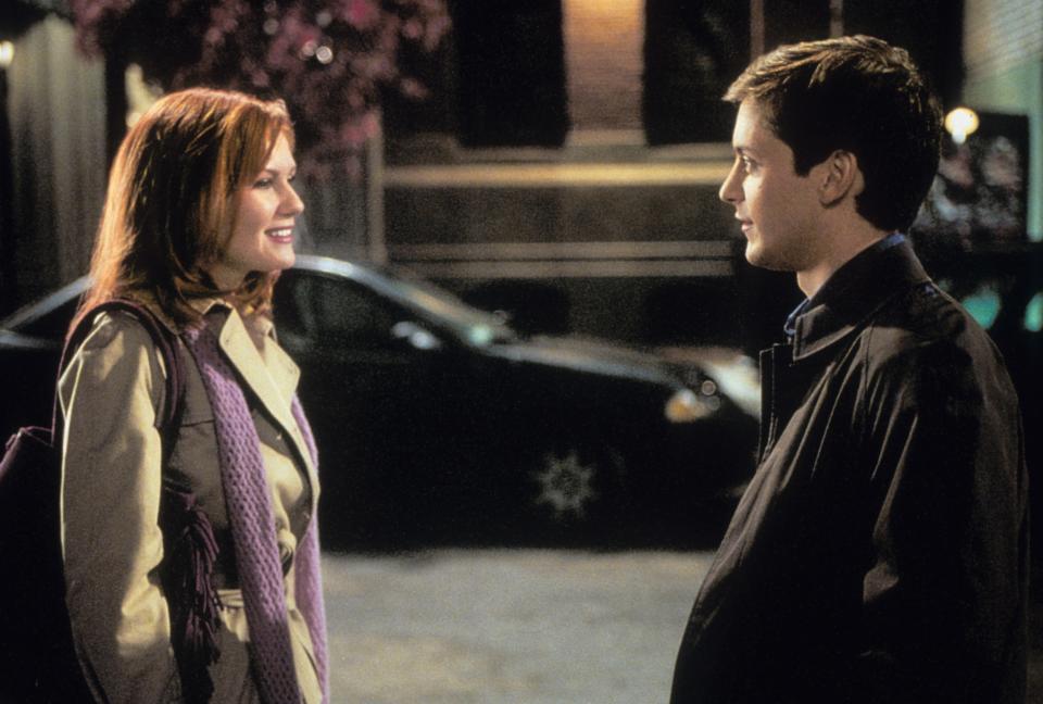 Tobey Maguire and Kirsten Dunst looking at one an other in a scene from the film 'Spiderman', 2002. (Photo by Columbia Pictures/Getty Images)