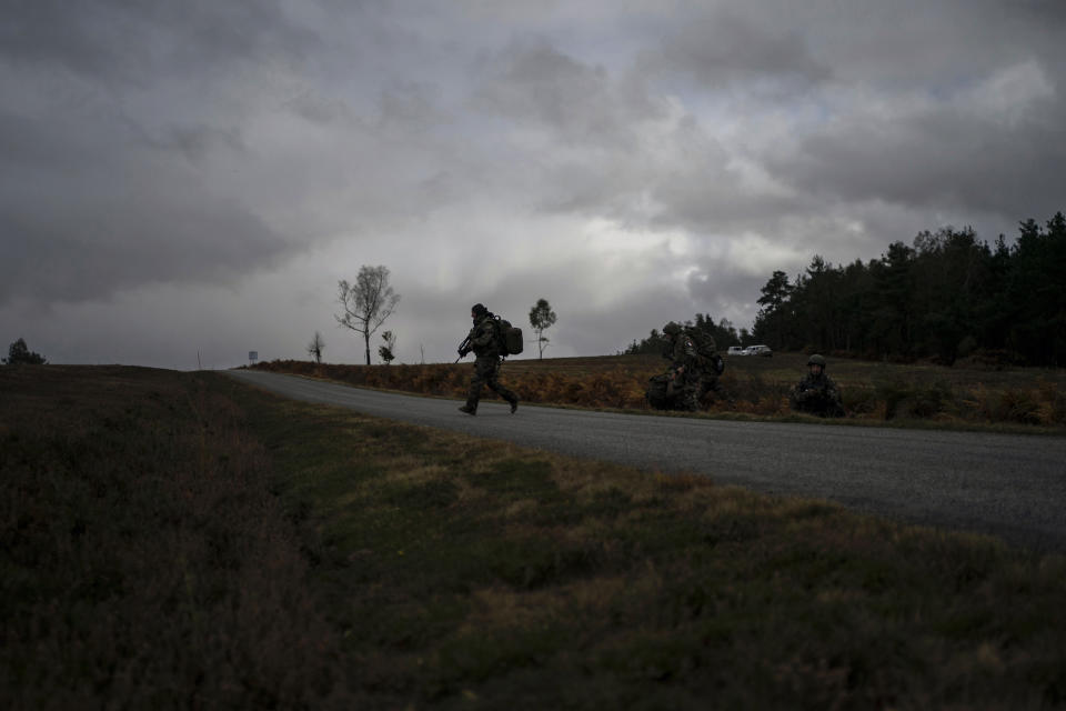 Ukrainian infantrymen train with French soldiers to learn combat skills, in France, Tuesday, Nov. 7, 2023. With the full-scale war grinding into a second winter, and casualties already counted in the hundreds of thousands continuing to mount on both sides, the training has become crucially important for Ukraine's chances of victory. (AP Photo/Laurent Cipriani)