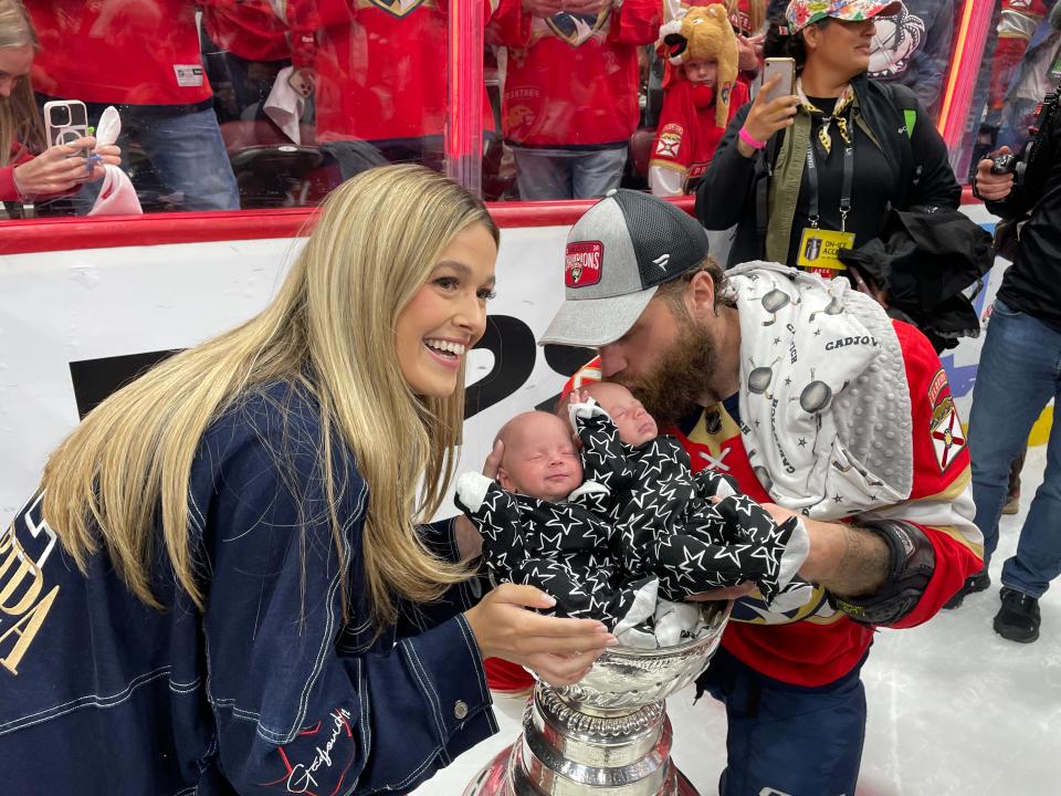 Florida Panthers forward Jonah Gadjovich and wife Allison place month-old twins Lion and Adalee inside the Stanley Cup after Florida defeated Edmonton 2-1 in Game 7 of the Cup Final at Amerant Bank Arena on Monday night.