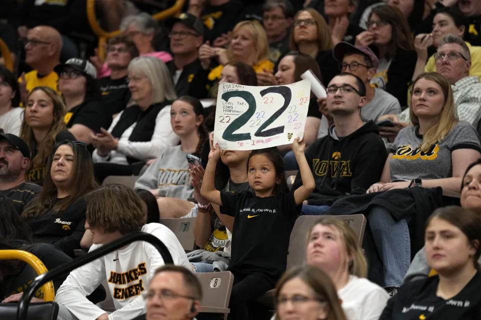 An Iowa fan watches an Iowa women's basketball team celebration, Wednesday, April 10, 2024, in Iowa City, Iowa. Iowa lost to South Carolina in the Final Four college basketball championship game of the women's NCAA Tournament on Sunday. (AP Photo/Charlie Neibergall)