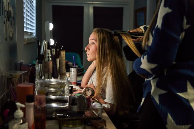 Madison's mother, Jennifer, brushes her hair at their home in Pembroke Pines, Florida.