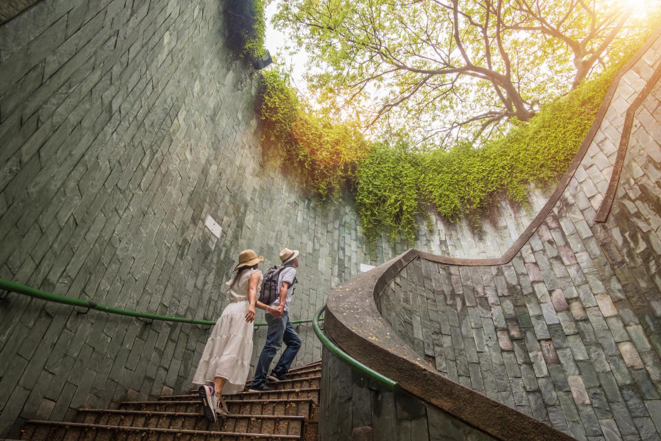 A couple exploring the underground spiral staircase at Fort Canning Park. (PHOTO: Getty Images)