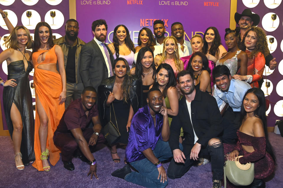 Group of "Love is Blind" reality show cast members posing together at a Netflix event