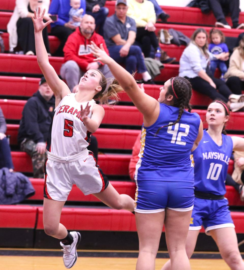 Crooksville's Brynn Lundell lays the ball in against Maysville's Sophia Dennis in Wednesday's game.