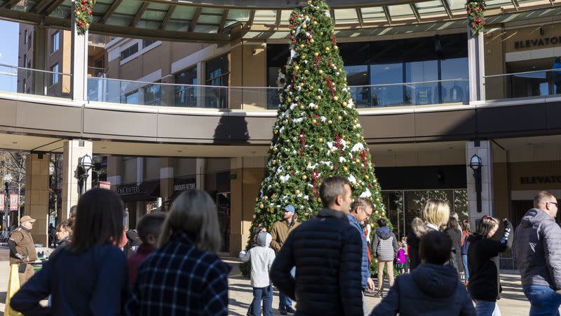 Shoppers walk around City Creek Center in Salt Lake City on Dec. 17, 2022.
