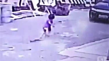 The child can be seen running towards his mother's car. Photo: YouTube