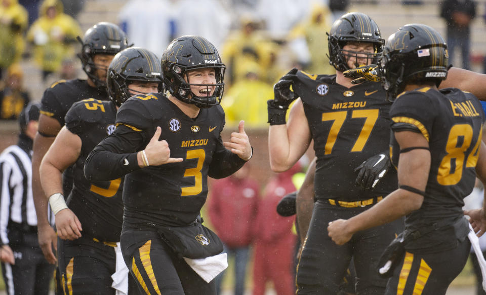 Missouri quarterback Drew Lock (3) celebrates a touchdown during the first half of an NCAA college football game against Arkansas Friday, Nov. 23, 2018, in Columbia, Mo. (AP Photo/L.G. Patterson)