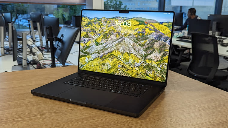 Space black 16-inch macbook pro on a desk in an office