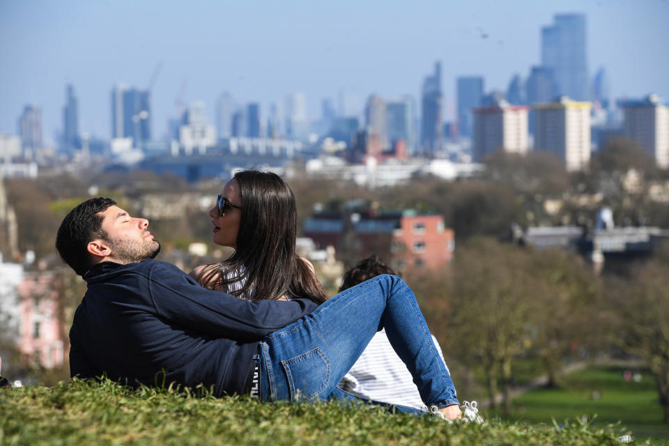 <p>People enjoy the sunshine on Primrose Hill in London. Picture date: Sunday April 4, 2021.</p>
