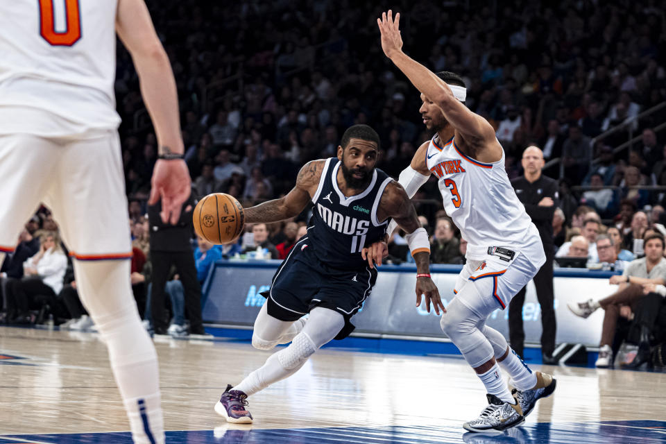 Dallas Mavericks guard Kyrie Irving (11) drives to the basket against New York Knicks guard Josh Hart (3) during the first half of an NBA basketball game in New York, Thursday, Feb. 8, 2024. (AP Photo/Peter K. Afriyie)