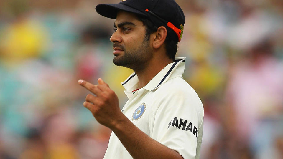 Virat Kohli gestures with his middle finger in 2012. (Photo by Mark Kolbe/Getty Images)