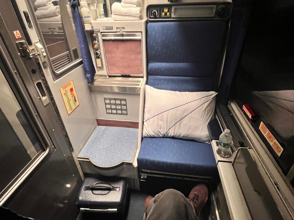 interior of amtrak roomette — seat on right and entrance on left