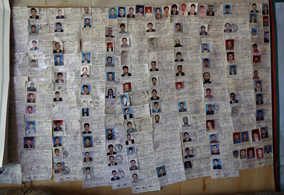 A chart of students who completed their training is seen on a wall at a driving school in Kabul