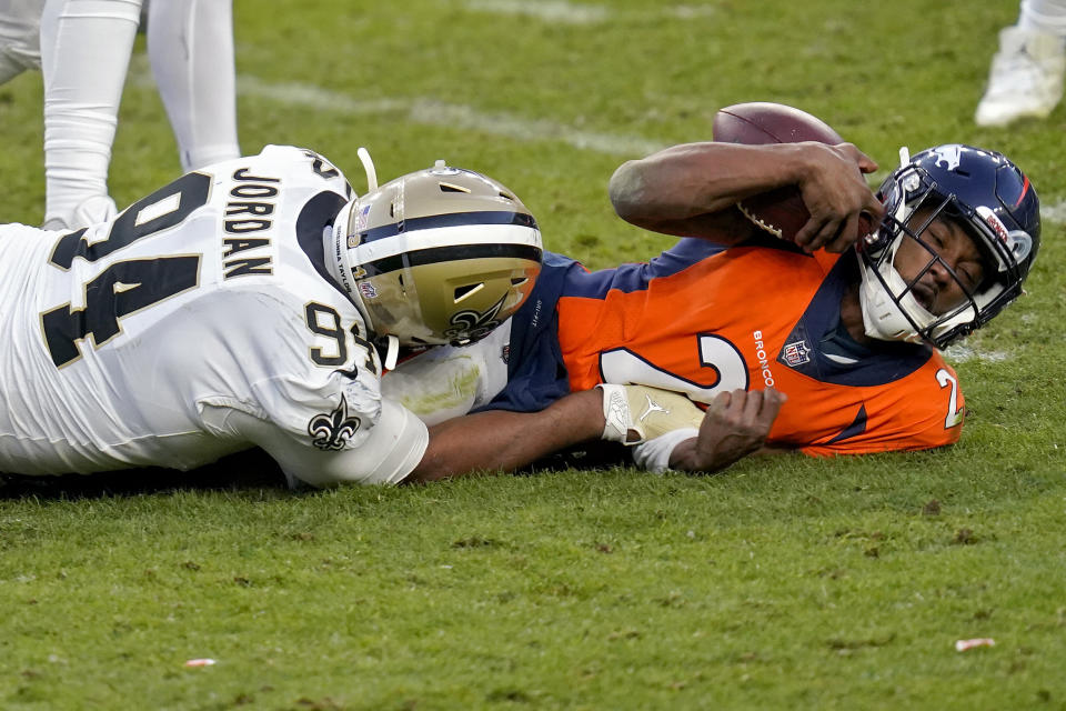 New Orleans Saints defensive end Cameron Jordan (94) sacks Denver Broncos quarterback Kendall Hinton (2) during the second half of an NFL football game, Sunday, Nov. 29, 2020, in Denver. (AP Photo/David Zalubowski)