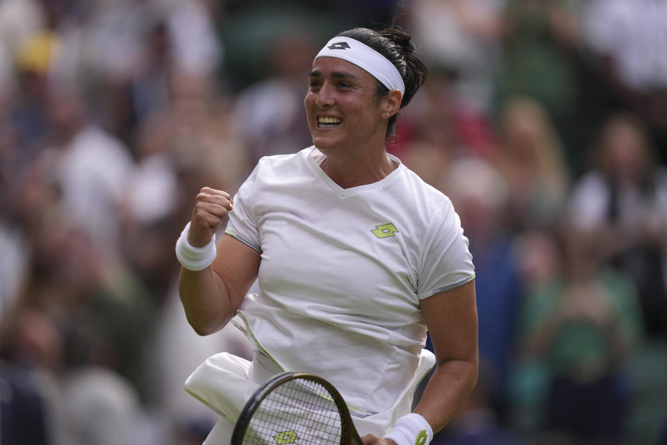 Tunisia's Ons Jabeur celebrates after beating Czech Republic's Petra Kvitova in a women's singles match on day eight of the Wimbledon tennis championships in London, Monday, July 10, 2023. (AP Photo/Alberto Pezzali)