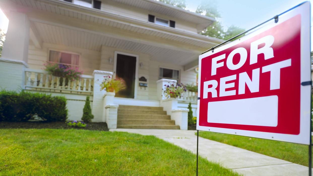 for sale sign in front yard