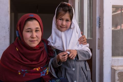 Fezah Rezayee with her daughter Fatima, 7 - Credit: Stefanie Glinski