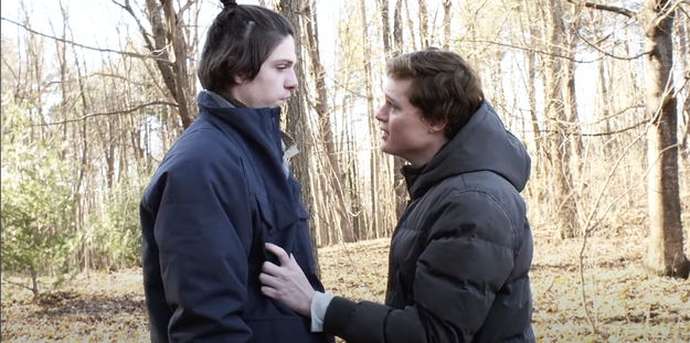 Sam and Grizz from "The Society" having words while Sam grabs Grizz's jacket