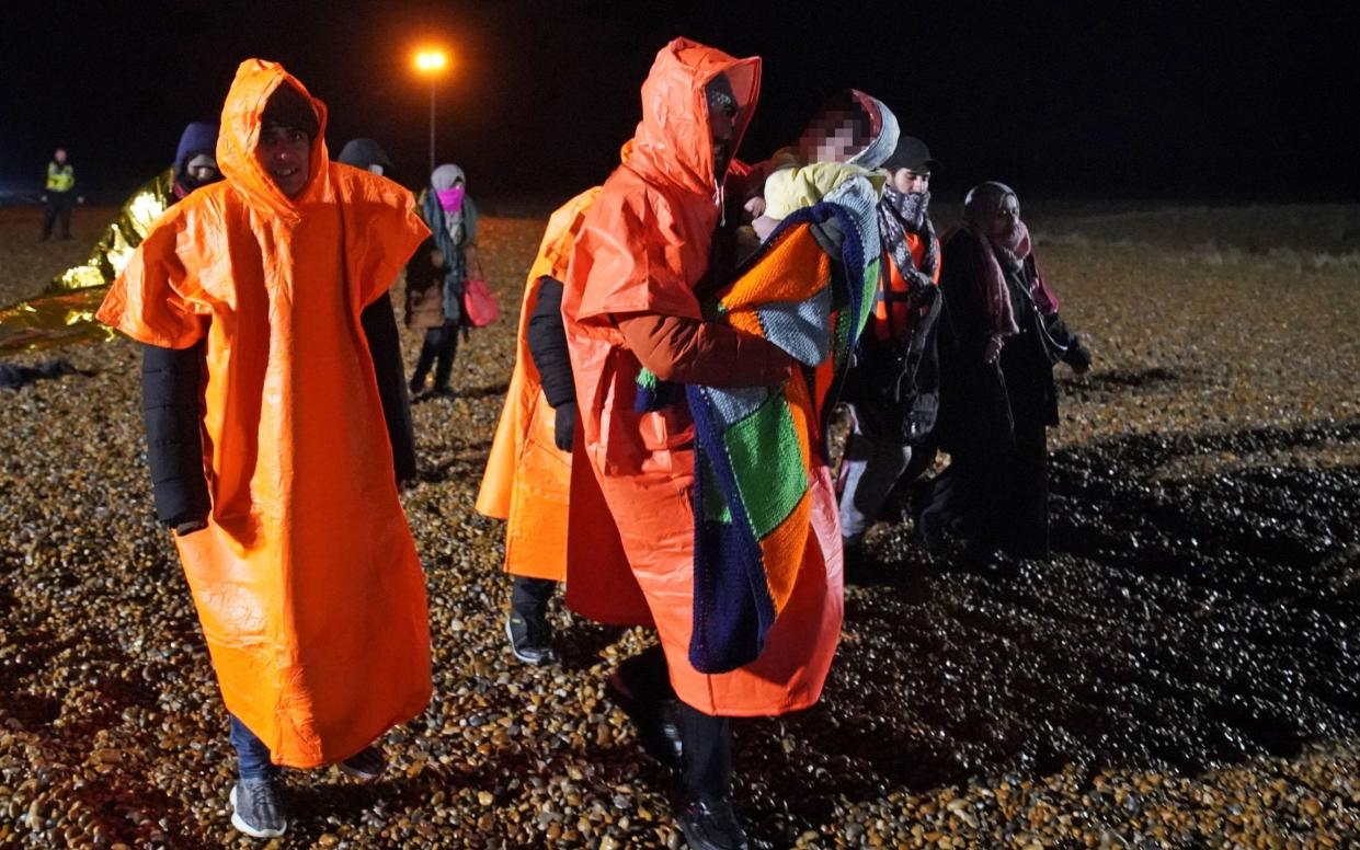 A group of people thought to be migrants are brought in to Dungeness, Kent, after being rescued by the RNLI on Saturday - Gareth Fuller/PA Wire