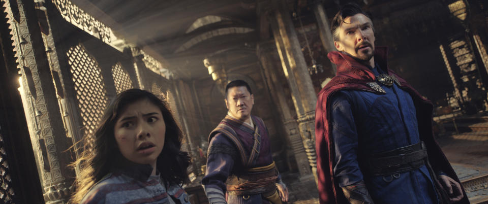 This image released by Marvel Studios shows, from left, Xochitl Gomez as America Chavez, Benedict Wong as Wong, and Benedict Cumberbatch as Dr. Stephen Strange in a scene from "Doctor Strange in the Multiverse of Madness." (Marvel Studios via AP)