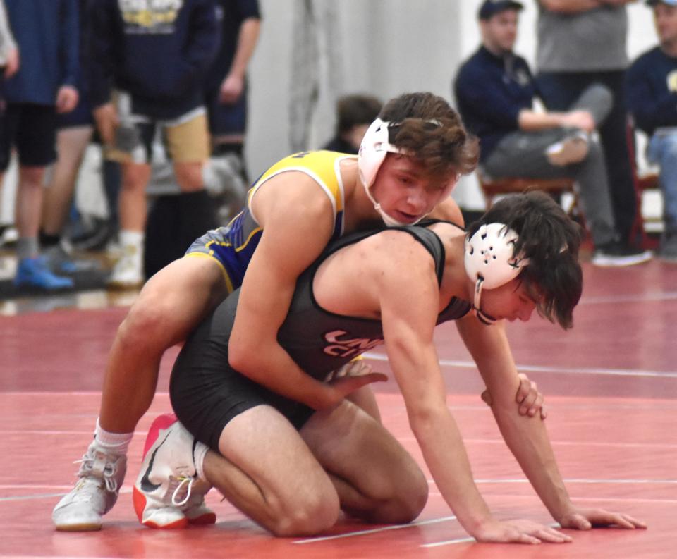 Bronson's Gabriel Erwin faces off with Union City's Montana Connell in the deciding match of the dual meet between the two rivals. Erwin went on to win 4-2 and give the Vikings the win